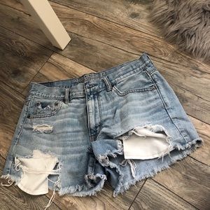 Light wash ripped jean shorts.